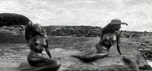 Mermaids looking out to sea